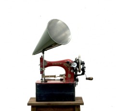 <div class="lightbox-artworktitle">Red Singer Sewing Machine</div><div class="lightbox-artworkyear">2013</div><div class="lightbox-artworkdescription">Sewing machine, wood, steel, aluminium, audio equipment, mechanical hardware and other materials</div><div class="lightbox-artworkdimension">73 x 48 x 45 cm (approx)</div><div class="lightbox-artworkdimension"></div><div class="lightbox-tagswithlinks"><a rel='nofollow' href='/page/1/?s=%23Series'>#Series</A> <a rel='nofollow' href='/page/1/?s=%23Steel'>#Steel</A> <a rel='nofollow' href='/page/1/?s=%23FoundObjects'>#FoundObjects</A> <a rel='nofollow' href='/page/1/?s=%23Kinetic'>#Kinetic</A> <a rel='nofollow' href='/page/1/?s=%23Wood'>#Wood</A></div>