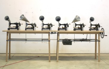 <div class="lightbox-artworktitle">Chorus for Six Singers</div><div class="lightbox-artworkyear">2013</div><div class="lightbox-artworkdescription">Sewing machines, wood, steel, aluminium, audio equipment, mechanical hardware and other materials</div><div class="lightbox-artworkdimension">171 x 372 x 65 cm</div><div class="lightbox-artworkdimension">Edition of 1</div><div class="lightbox-tagswithlinks"><a rel='nofollow' href='/page/1/?s=%23Series'>#Series</A> <a rel='nofollow' href='/page/1/?s=%23Steel'>#Steel</A> <a rel='nofollow' href='/page/1/?s=%23FoundObjects'>#FoundObjects</A> <a rel='nofollow' href='/page/1/?s=%23Kinetic'>#Kinetic</A> <a rel='nofollow' href='/page/1/?s=%23Wood'>#Wood</A></div>