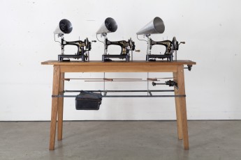 <div class="lightbox-artworktitle">Singer Trio</div><div class="lightbox-artworkyear">2016-2017</div><div class="lightbox-artworkdescription">Singer sewing machines, four breast drills, antique wooden rulers, mild steel, aluminium, wood, electronics, Soundtrack: 3 minutes 39 seconds</div><div class="lightbox-artworkdimension">163 x 176 x 50 cm </div><div class="lightbox-artworkdimension"></div><div class="lightbox-tagswithlinks"><a rel='nofollow' href='/page/1/?s=%23Series'>#Series</A> <a rel='nofollow' href='/page/1/?s=%23Steel'>#Steel</A> <a rel='nofollow' href='/page/1/?s=%23FoundObjects'>#FoundObjects</A> <a rel='nofollow' href='/page/1/?s=%23Kinetic'>#Kinetic</A> <a rel='nofollow' href='/page/1/?s=%23Wood'>#Wood</A></div>
