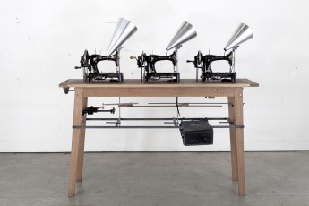 <div class="lightbox-artworktitle">Singer Trio</div><div class="lightbox-artworkyear">2019</div><div class="lightbox-artworkdescription">Singer sewing machines, four breast drills, antique wooden rulers, mild steel, aluminium, wood, electronics, Soundtrack: 3 minutes 39 seconds</div><div class="lightbox-artworkdimension">163 x 176 x 50 cm</div><div class="lightbox-artworkdimension"></div><div class="lightbox-tagswithlinks"><a rel='nofollow' href='/page/1/?s=%23Series'>#Series</A> <a rel='nofollow' href='/page/1/?s=%23Steel'>#Steel</A> <a rel='nofollow' href='/page/1/?s=%23FoundObjects'>#FoundObjects</A> <a rel='nofollow' href='/page/1/?s=%23Kinetic'>#Kinetic</A> <a rel='nofollow' href='/page/1/?s=%23Wood'>#Wood</A></div>